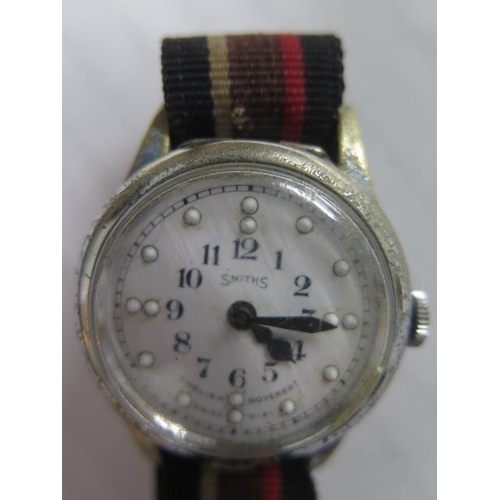 242 - A Smiths Brail wristwatch on a Military strap in working order in its original box