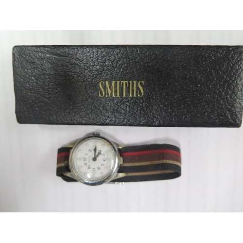 242 - A Smiths Brail wristwatch on a Military strap in working order in its original box