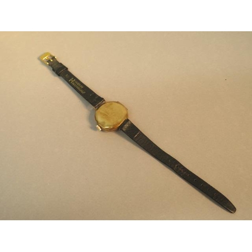 244 - A 15ct yellow gold (hallmarked) cased ladies Trench watch - round case approx 23mm with leather stra... 