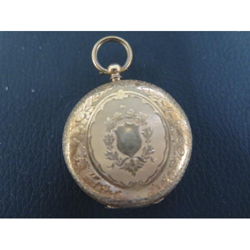 252 - An 18ct gold fob watch with a gold cavette - stamped 18K - approx weight 30 grams