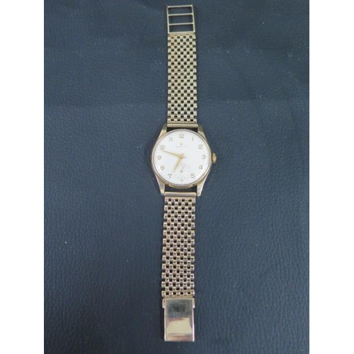 256 - A Zenith 9ct gold gentleman's wristwatch with gold Arabic numerals and hands, seconds subsidiary dia... 