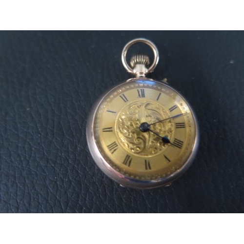 264 - A 9ct gold keyless open face fob watch the 25mm dial with Roman numerals - approx weight 16.85 grams... 