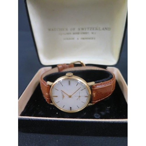 274 - A gents 18ct gold Longines watch with seconds hand on a leather strap - in its original Watches of S... 