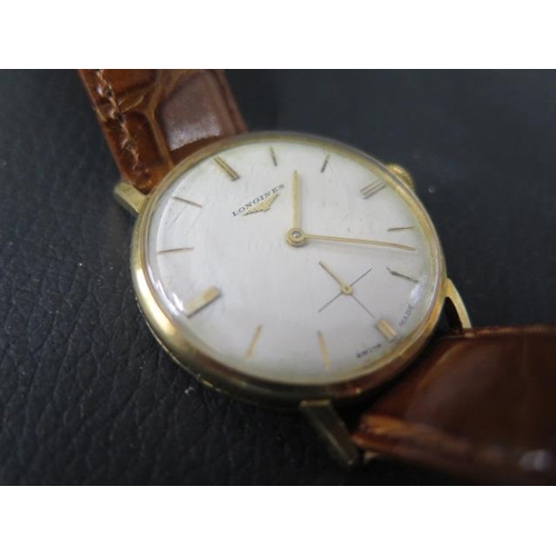 274 - A gents 18ct gold Longines watch with seconds hand on a leather strap - in its original Watches of S... 