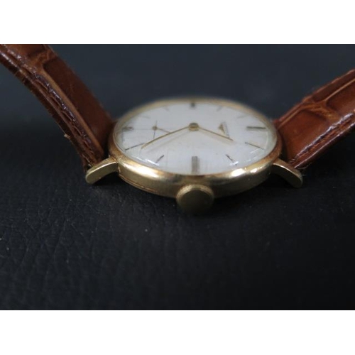 274 - A gents 18ct gold Longines watch with seconds hand on a leather strap - in its original Watches of S... 