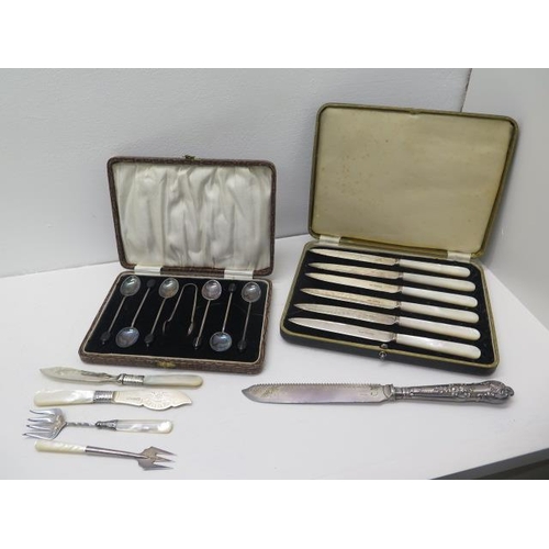 284A - A boxed set of six silver coffee bean spoons with sugar tongs, Birmingham 1923 with a boxed set of s... 