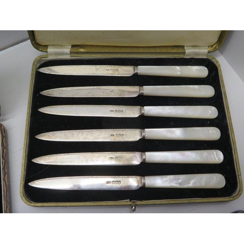 284A - A boxed set of six silver coffee bean spoons with sugar tongs, Birmingham 1923 with a boxed set of s... 