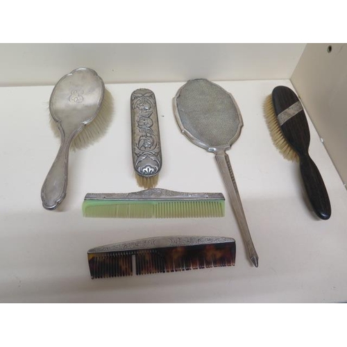 298 - Six mixed silver mounted dressing table set items including mirror, three brushes and two combs