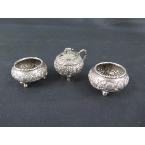 301 - A pair of Indian silver (tested) salts and a mustard pot - salts approx 5.5cm diameter - with anothe... 