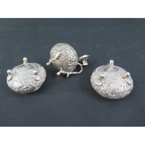 301 - A pair of Indian silver (tested) salts and a mustard pot - salts approx 5.5cm diameter - with anothe... 