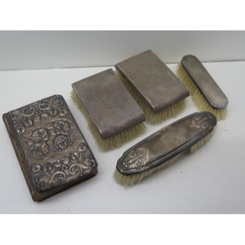 303A - Four silver backed brushes and a silver backed Bible