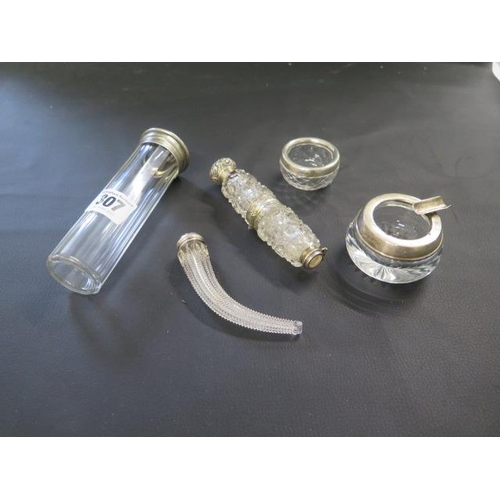 307 - Five pieces of silver topped cut glass including a cornucopia bottle and hinged double bottle