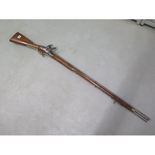 447 - A circa 1800 Brown Bess flintlock musket, tower proof - in good condition, the stock with a nice pat... 