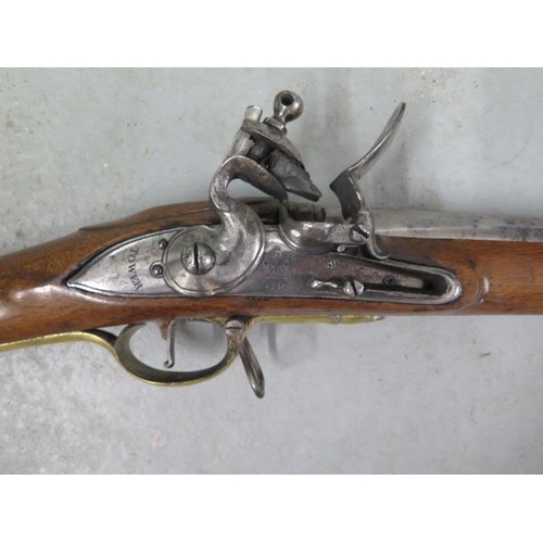 447 - A circa 1800 Brown Bess flintlock musket, tower proof - in good condition, the stock with a nice pat... 