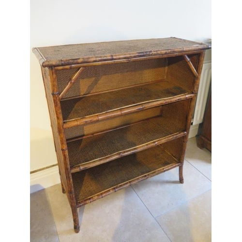 503 - A Bamboo and rattan wicker small bookcase - good overall condition - approx 107cm x 92cm x 36cm