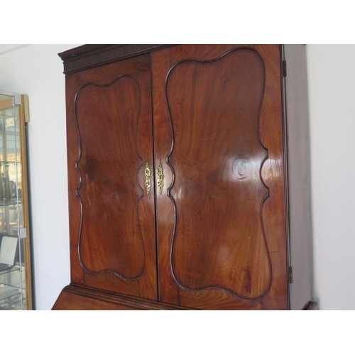 508 - A good quality early 19th century flame mahogany bureau bookcase with two doors above the base which... 