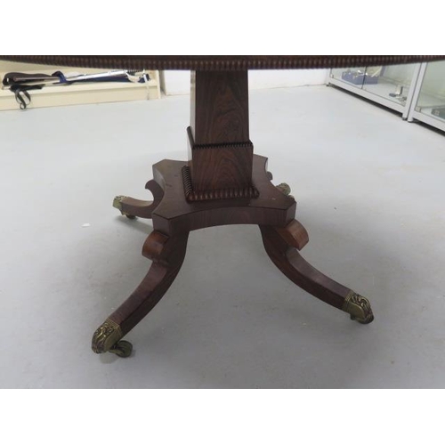 509 - A Regency period rosewood circular tilt top dining table - Diameter 115cm - on four out swept legs w... 