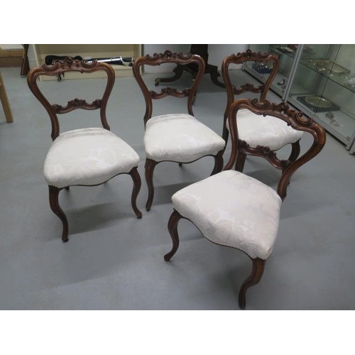 510 - A set of four mahogany dining chairs on cabriole legs - in good condition, nicely upholstered in a c... 