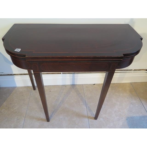 512 - A 19th century mahogany and inlaid fold over card table on square tapering legs - Width 92cm