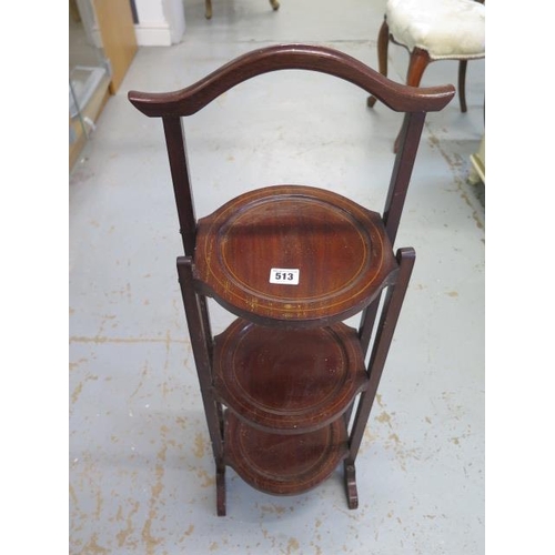 513 - An Edwardian mahogany and inlaid folding cake stand