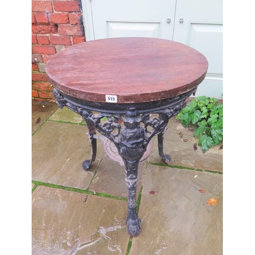 515 - A cast iron pub table with a wooden top