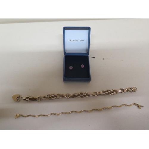 67 - Two 9ct yellow gold bracelets hallmarked - weight approx 10 grams - with a pair of 9ct (tested) and ... 