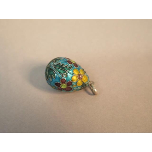 72 - A silver and enamel egg pendant - approx 2.5cm - with two silver and enamel reticulated fish pendant... 