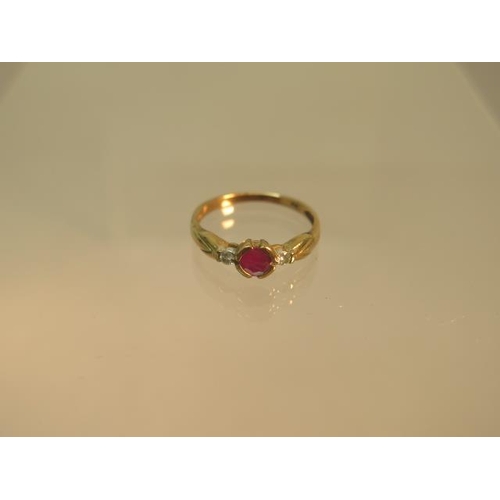 76 - A 9ct yellow gold ring with ruby and diamonds - ring size N - hallmarked - approx weight 1.8 grams