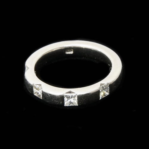 78 - A good platinum band set with four princess cut diamonds - total diamond weight approx 0.56ct - ring... 