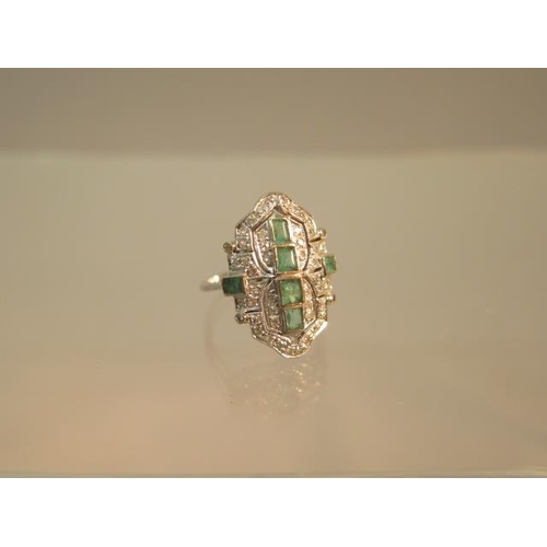 84 - An Art Deco emerald and diamond ring set in platinum (tested) ring size M