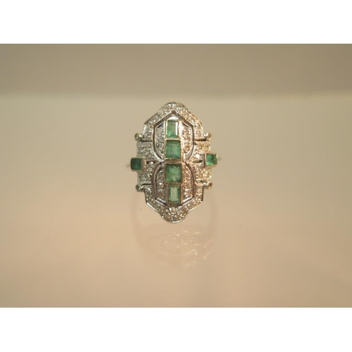 84 - An Art Deco emerald and diamond ring set in platinum (tested) ring size M