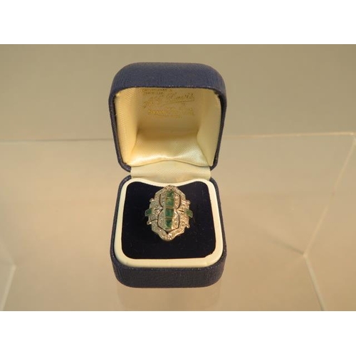 84 - An Art Deco emerald and diamond ring set in platinum (tested) ring size M