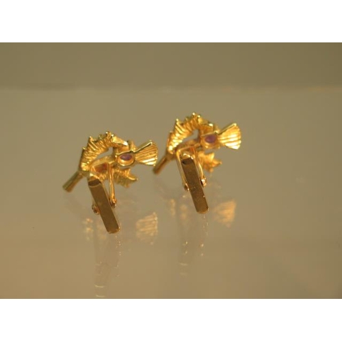 88 - A pair of 9ct gold (hallmarked) ruby cufflinks as Scottish thistles - approx 2.5cm - weight approx 8... 