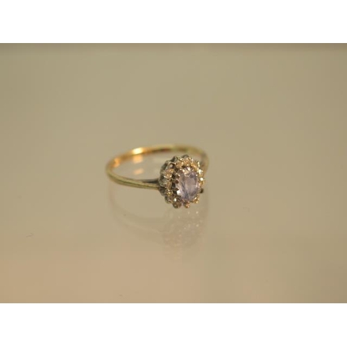 98 - A 9ct hallmarked yellow gold sapphire and diamond cluster ring size J - weight approx 1.4 grams