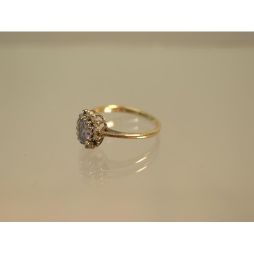 98 - A 9ct hallmarked yellow gold sapphire and diamond cluster ring size J - weight approx 1.4 grams