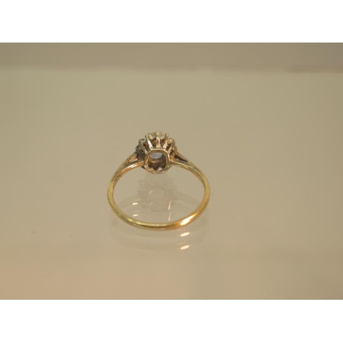 98 - A 9ct hallmarked yellow gold sapphire and diamond cluster ring size J - weight approx 1.4 grams