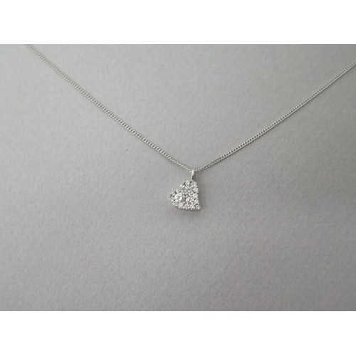 213 - An 18ct white gold (hallmarked) and diamond heart pendant on chain, pendant set with three round bri... 