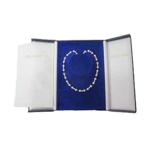 216 - A single string of pearls with cabochon blue sapphires, round pearls of two sizes set in triplet div... 