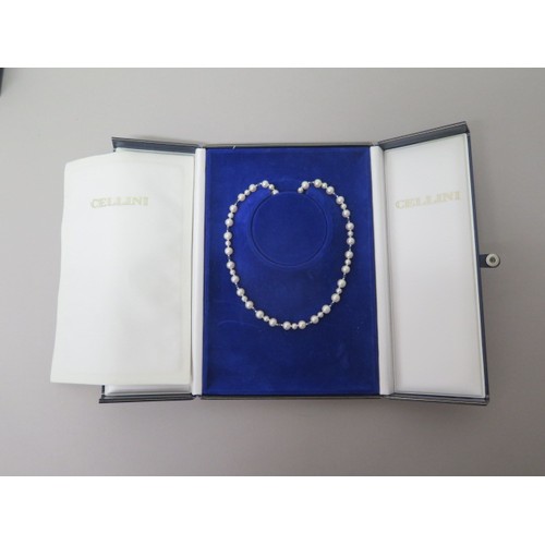 216 - A single string of pearls with cabochon blue sapphires, round pearls of two sizes set in triplet div... 