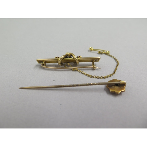 49 - A 14ct yellow gold (un hallmarked but tested) brooch with rubies approx 4cm - weight approx 3.8 gram... 