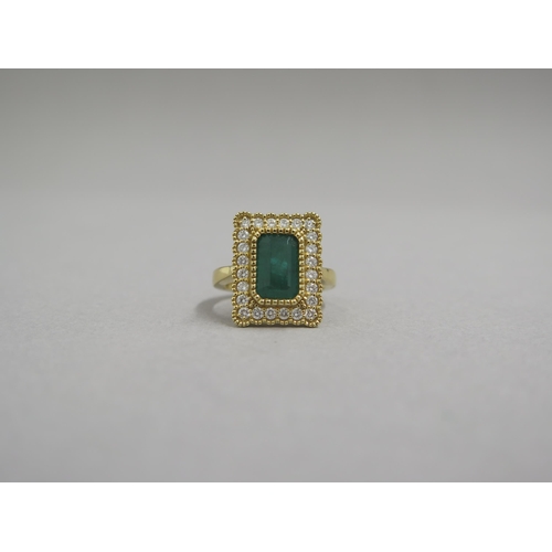 118 - A very good 18ct yellow gold (hallmarked) emerald and diamond ring - the rectangular step cut emeral... 