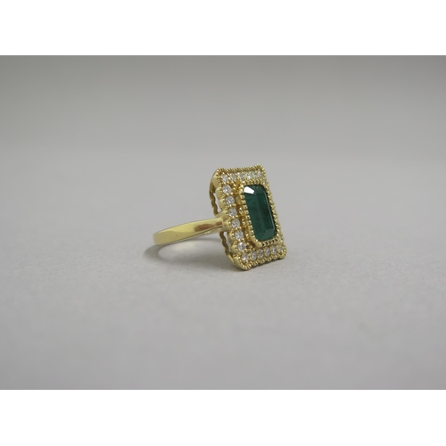 118 - A very good 18ct yellow gold (hallmarked) emerald and diamond ring - the rectangular step cut emeral... 