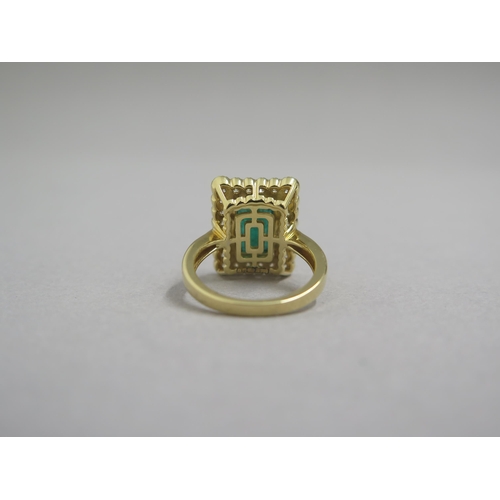 118 - A very good 18ct yellow gold (hallmarked) emerald and diamond ring - the rectangular step cut emeral... 