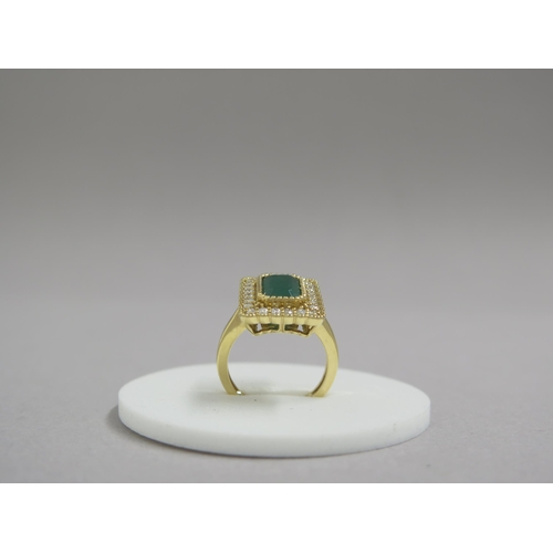 118 - A very good 18ct yellow gold (hallmarked) emerald and diamond ring - the rectangular step cut emeral... 