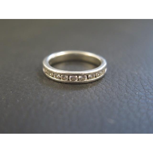 162 - A platinum and diamond half eternity ring size L/M - weight approx 6.6 grams - with retailers certif... 