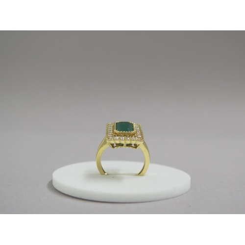 6 - A very good 18ct yellow gold (hallmarked) emerald and diamond ring - the rectangular step cut emeral... 
