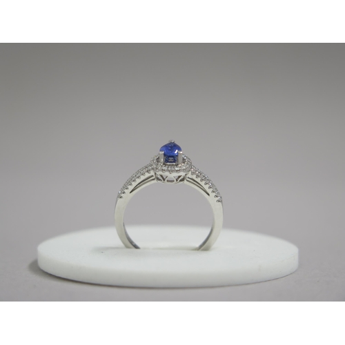 7 - An 18ct white gold pear shaped sapphire and diamond ring, diamonds are well matched and bright and l... 