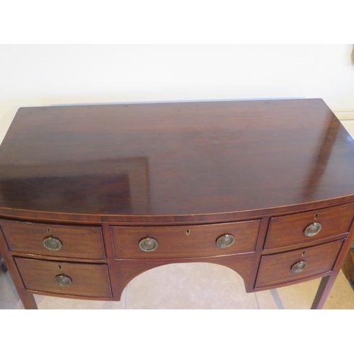 576 - A Georgian mahogany and inlaid bow fronted Sheraton sideboard - in good condition with a good colour... 