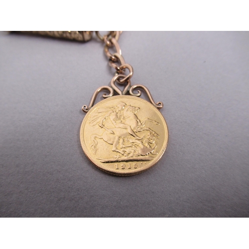 14 - A 9ct hallmarked chain with a 1915 gold sovereign, a 9ct (tested) pencil and case, a 9ct hallmarked ... 