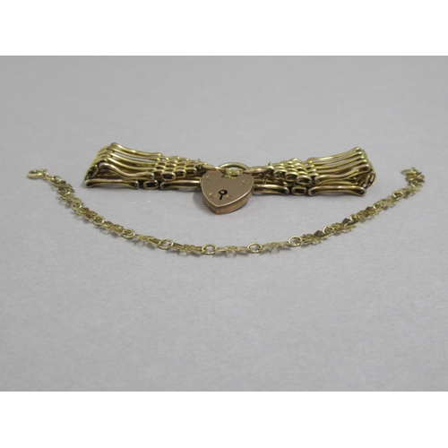 170 - A 9ct yellow gold (hallmarked) gate link bracelet with heart lock - good overall condition, approx w... 